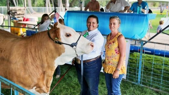 Kayla and Karin Kayla and Karin with a prize winning beef at FFA show